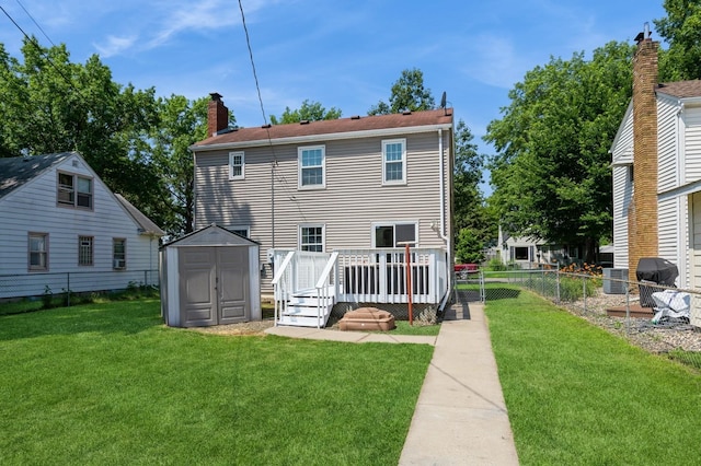 1290 Matilda St, Saint Paul, MN 55117 - back of property with a storage shed, a deck, and a chimney
