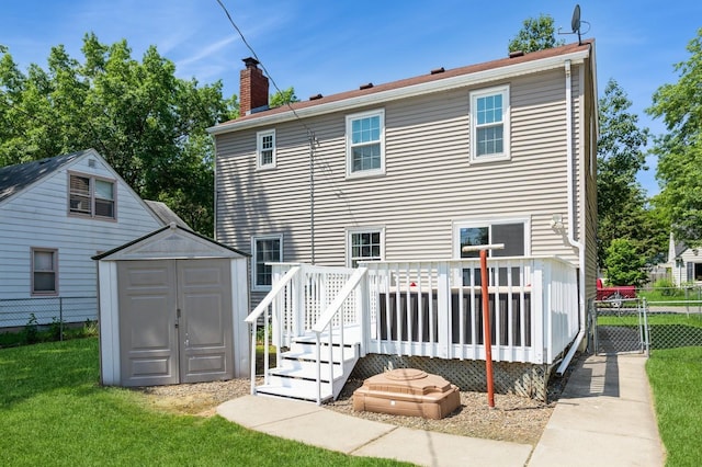 1290 Matilda St, Saint Paul, MN 55117 - back of house with a shed, a chimney, and a wooden deck