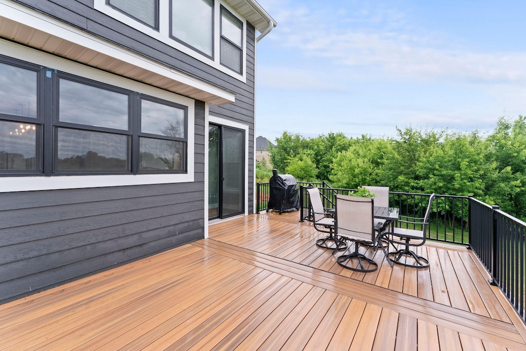 8750 Vernon St, Greenfield, MN 55373 - wooden terrace featuring outdoor dining space and area for grilling