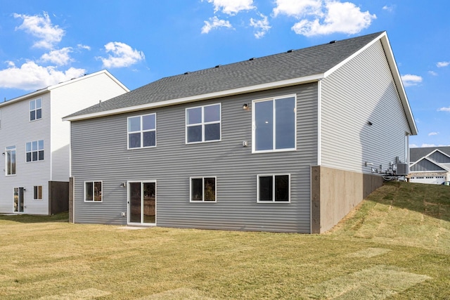 2556 Buffalo Ridge Dr, Buffalo, MN 55313 - rear view of house featuring a yard and a shingled roof