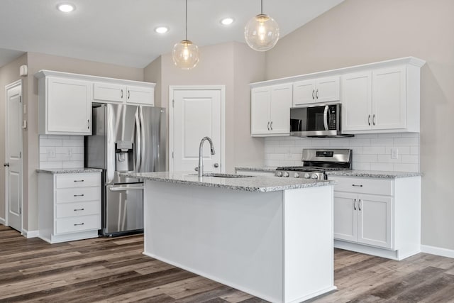 2556 Buffalo Ridge Dr, Buffalo, MN 55313 - kitchen featuring appliances with stainless steel finishes, white cabinetry, decorative backsplash, dark wood-style floors, and recessed lighting