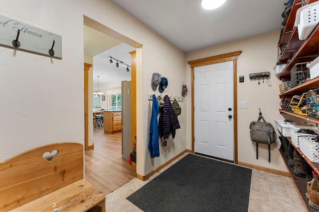 4508 192nd St, Fair Haven Twp, MN 55382 - foyer entrance with track lighting and light tile patterned floors