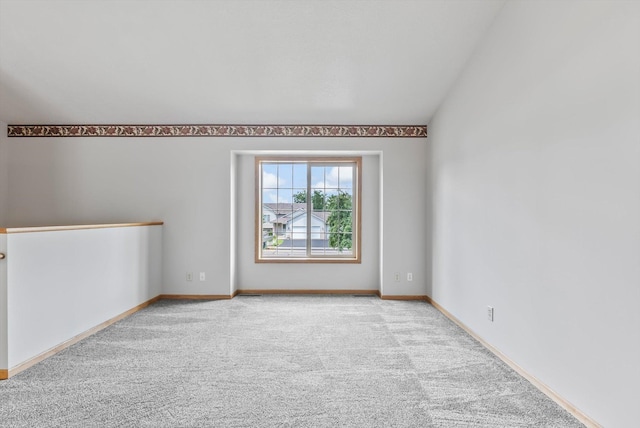 6617 378th St, North Branch, MN 55056 - carpeted spare room with vaulted ceiling and baseboards