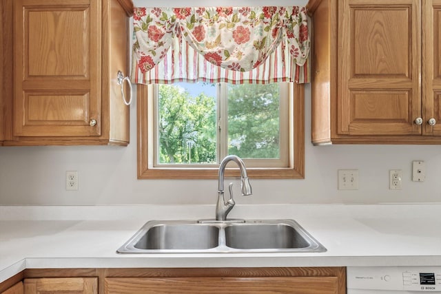 6617 378th St, North Branch, MN 55056 - kitchen with light countertops, white dishwasher, and brown cabinets