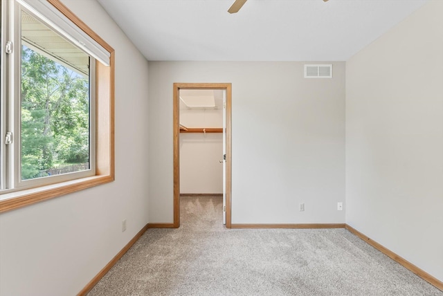 6617 378th St, North Branch, MN 55056 - unfurnished bedroom featuring carpet floors, a walk in closet, and ceiling fan