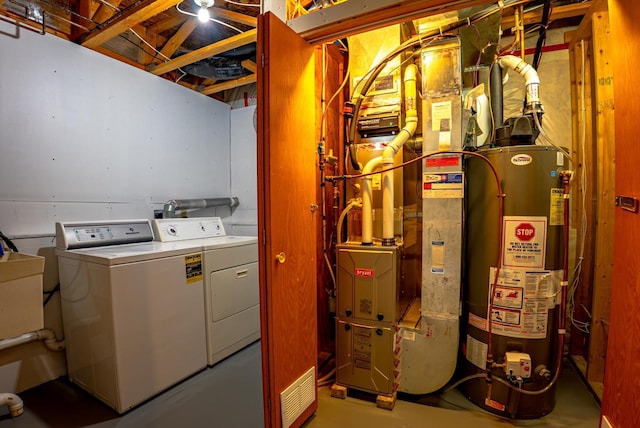 6617 378th St, North Branch, MN 55056 - washroom featuring gas water heater, washer and dryer, and heating unit