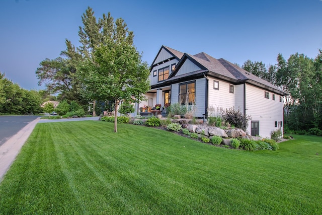 6291 Red Fox Rd, Lino Lakes, MN 55014 - view of front of home with a front lawn and board and batten siding
