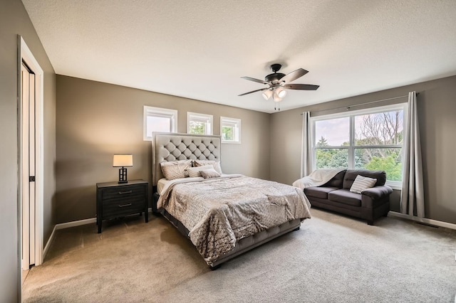 1535 138th St E, Rosemount, MN 55068 - bedroom with light colored carpet, ceiling fan, and a textured ceiling