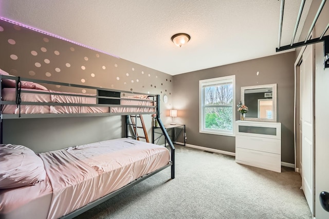 1535 138th St E, Rosemount, MN 55068 - bedroom featuring light colored carpet and a textured ceiling