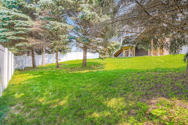 1535 138th St E, Rosemount, MN 55068 - fenced backyard featuring stairs and a wooden deck