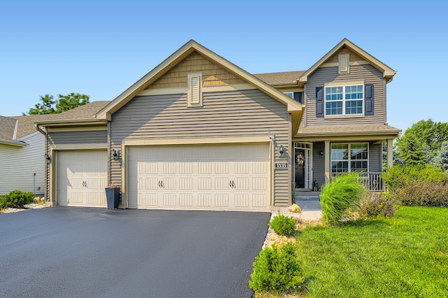 1535 138th St E, Rosemount, MN 55068 - traditional-style home featuring driveway, a garage, and a front lawn