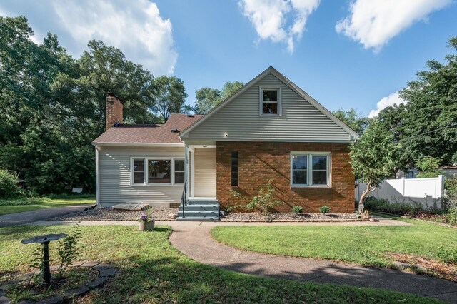 1595 Reaney Ave, Saint Paul, MN 55106 - view of front of home with a chimney and brick siding