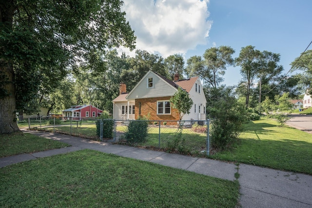 1595 Reaney Ave, Saint Paul, MN 55106 - view of front of house featuring a chimney, a fenced front yard, a gate, and brick siding