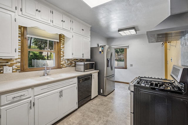 1595 Reaney Ave, Saint Paul, MN 55106 - kitchen featuring appliances with stainless steel finishes, exhaust hood, white cabinetry, decorative backsplash, and light countertops