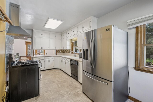 1595 Reaney Ave, Saint Paul, MN 55106 - kitchen with stainless steel appliances, wall chimney exhaust hood, light countertops, and white cabinets