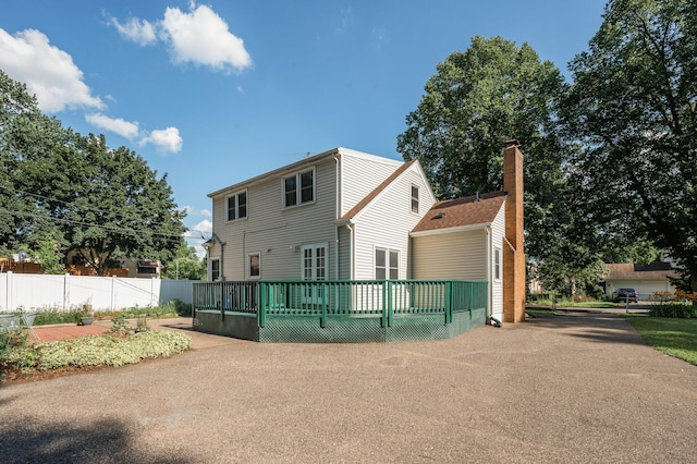1595 Reaney Ave, Saint Paul, MN 55106 - rear view of house with a deck and a chimney