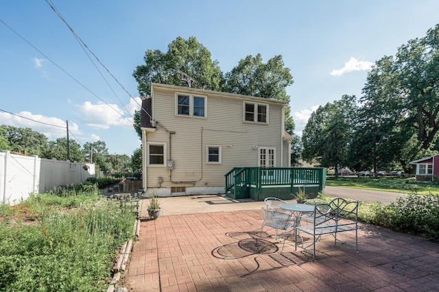 1595 Reaney Ave, Saint Paul, MN 55106 - back of property featuring a patio area, a wooden deck, and outdoor dining area