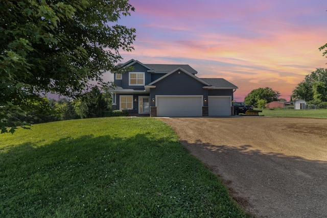 3410 Boulder Trl, Webster, MN 55088 - view of front of home with an attached garage, a lawn, and dirt driveway