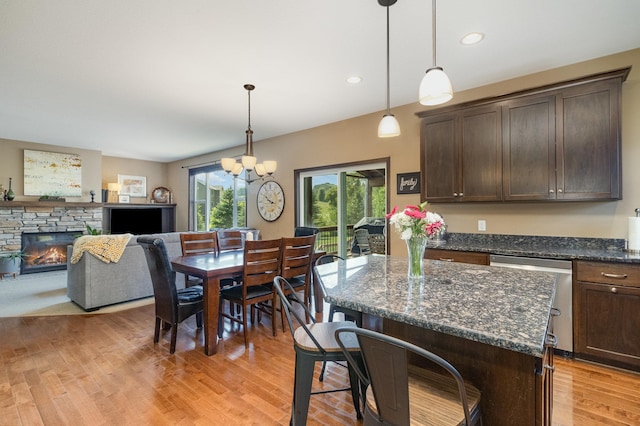 3410 Boulder Trl, Webster, MN 55088 - kitchen with stainless steel dishwasher, dark brown cabinets, a chandelier, light wood-type flooring, and recessed lighting