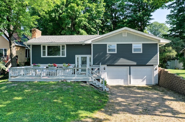 8112 Shore Trl N, Forest Lake, MN 55025 - raised ranch featuring an attached garage, brick siding, a chimney, driveway, and a deck