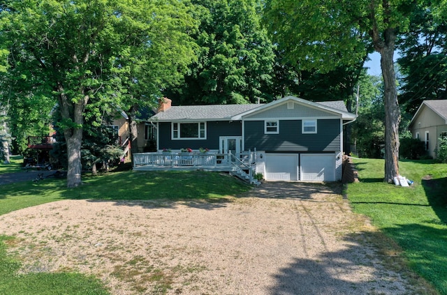 8112 Shore Trl N, Forest Lake, MN 55025 - bi-level home featuring an attached garage, driveway, a chimney, a front yard, and a wooden deck