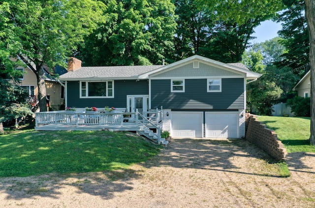 8112 Shore Trl N, Forest Lake, MN 55025 - raised ranch with an attached garage, a chimney, a front yard, a deck, and driveway