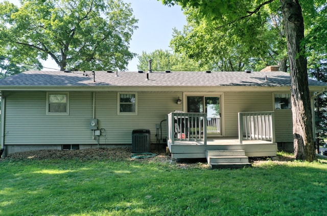 8112 Shore Trl N, Forest Lake, MN 55025 - rear view of property featuring a shingled roof, a lawn, a wooden deck, and a chimney