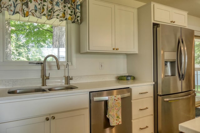 8112 Shore Trl N, Forest Lake, MN 55025 - kitchen featuring stainless steel appliances, light countertops, and white cabinetry