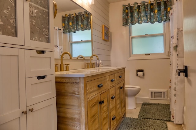 8112 Shore Trl N, Forest Lake, MN 55025 - bathroom with double vanity, plenty of natural light, and tile patterned flooring