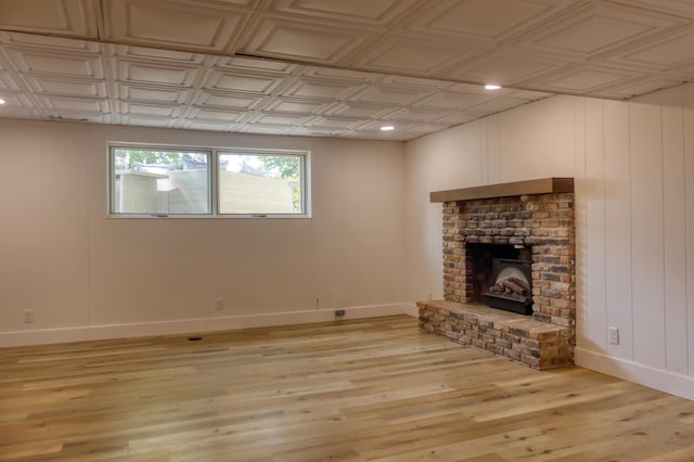 8112 Shore Trl N, Forest Lake, MN 55025 - unfurnished living room with light wood-type flooring, a brick fireplace, recessed lighting, and an ornate ceiling