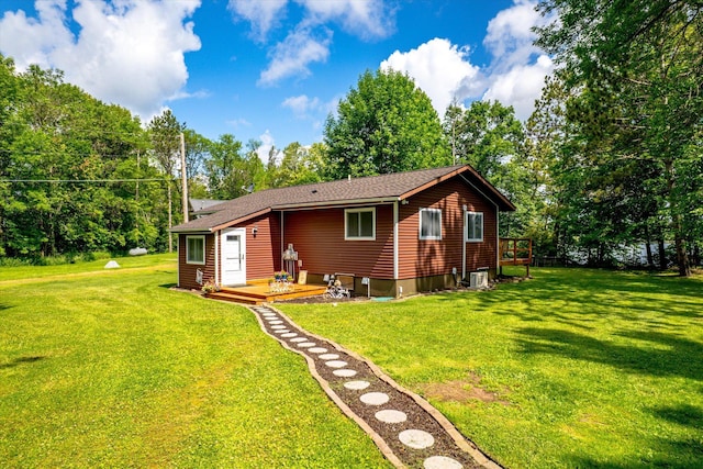 36977 Shoreland Rd, Sturgeon Lake, MN 55783 - rear view of house with a lawn and a wooden deck