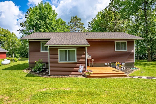 36977 Shoreland Rd, Sturgeon Lake, MN 55783 - back of property with a deck, a yard, and a shingled roof