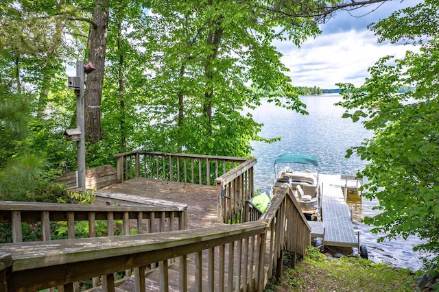 36977 Shoreland Rd, Sturgeon Lake, MN 55783 - wooden deck featuring a water view and a dock