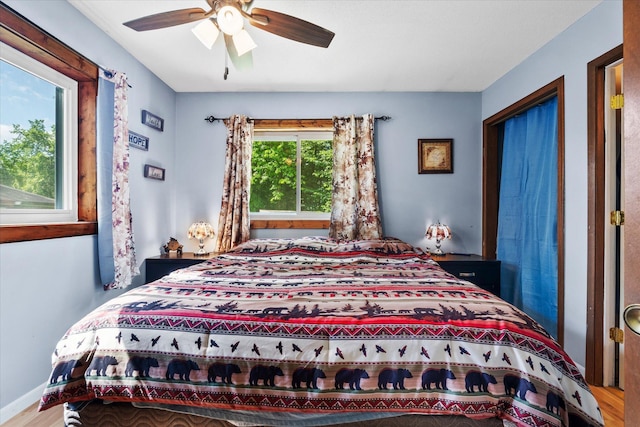 36977 Shoreland Rd, Sturgeon Lake, MN 55783 - bedroom with wood finished floors and ceiling fan