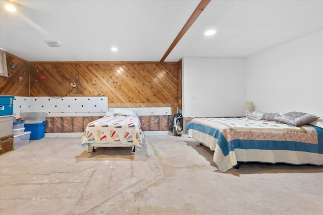 36977 Shoreland Rd, Sturgeon Lake, MN 55783 - bedroom with unfinished concrete flooring, recessed lighting, and wood walls