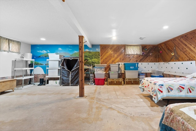 36977 Shoreland Rd, Sturgeon Lake, MN 55783 - bedroom with wooden walls and concrete flooring