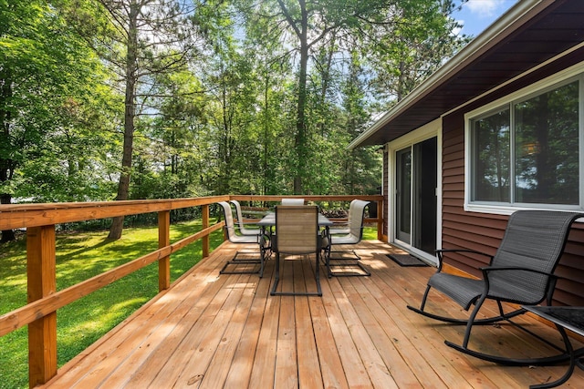 36977 Shoreland Rd, Sturgeon Lake, MN 55783 - deck with outdoor dining area and a yard