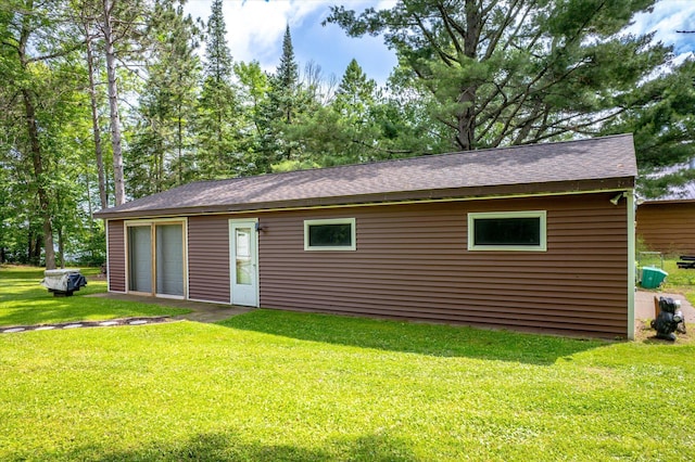 36977 Shoreland Rd, Sturgeon Lake, MN 55783 - rear view of house featuring a yard and roof with shingles