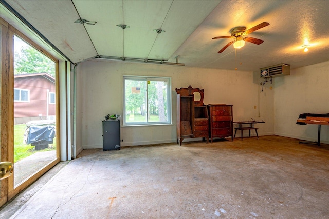 36977 Shoreland Rd, Sturgeon Lake, MN 55783 - garage featuring a ceiling fan and baseboards