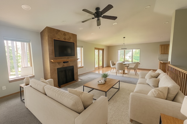 13205 Lake Place Rd, Baldwin Twp, MN 55398 - living room featuring recessed lighting, a ceiling fan, a tile fireplace, and light carpet