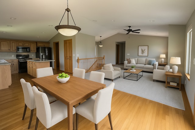13205 Lake Place Rd, Baldwin Twp, MN 55398 - dining space with vaulted ceiling, wood finished floors, a ceiling fan, and recessed lighting