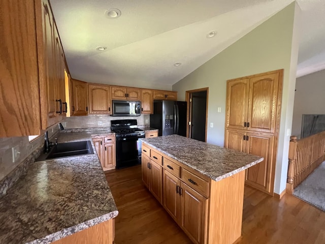 13205 Lake Place Rd, Baldwin Twp, MN 55398 - kitchen with black appliances, lofted ceiling, dark wood-style flooring, tasteful backsplash, and a center island