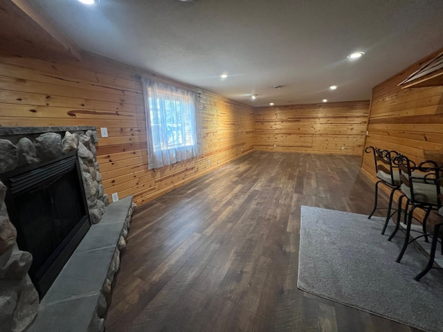 13205 Lake Place Rd, Baldwin Twp, MN 55398 - unfurnished living room featuring wooden walls, hardwood / wood-style flooring, a fireplace, and recessed lighting