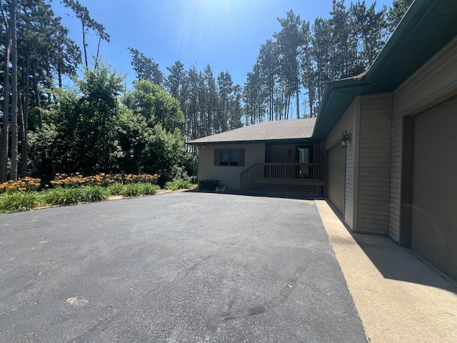 13205 Lake Place Rd, Baldwin Twp, MN 55398 - view of side of home with driveway and roof with shingles