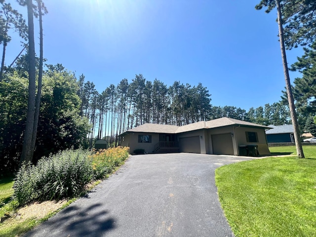 13205 Lake Place Rd, Baldwin Twp, MN 55398 - view of front facade featuring an attached garage, asphalt driveway, and a front yard