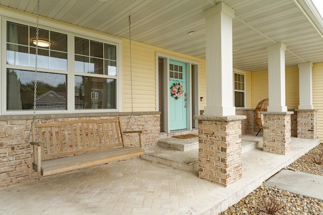 2990 Pinewood Ridge Dr SE, Rochester, MN 55904 - view of exterior entry featuring covered porch