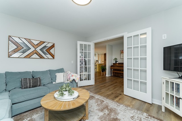 2990 Pinewood Ridge Dr SE, Rochester, MN 55904 - living room with french doors and wood finished floors