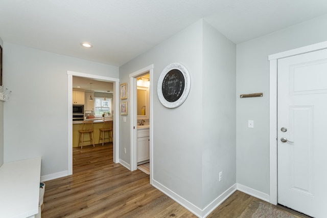 2990 Pinewood Ridge Dr SE, Rochester, MN 55904 - hall with wood finished floors and recessed lighting
