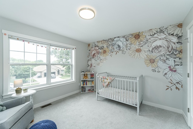 2990 Pinewood Ridge Dr SE, Rochester, MN 55904 - carpeted bedroom featuring baseboards and a crib