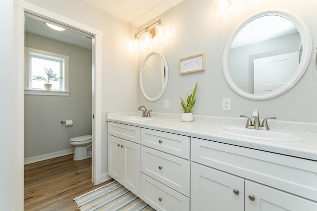 2990 Pinewood Ridge Dr SE, Rochester, MN 55904 - bathroom featuring double vanity and wood finished floors